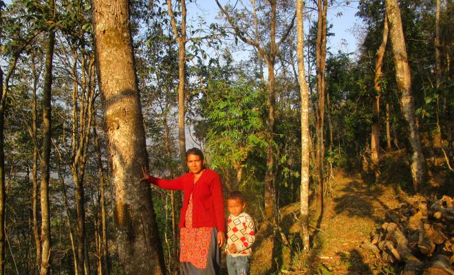 Private forest owner in Sindhupalkchok with her son. Courtesy of Ganga Neupane